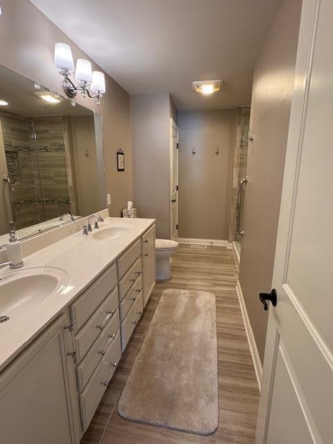 2307 Legend Circle Chesterton, IN 46304 - Photo 11 of 24 a spacious bathroom with a double vanity sink a large mirror a shower and a bathtub
