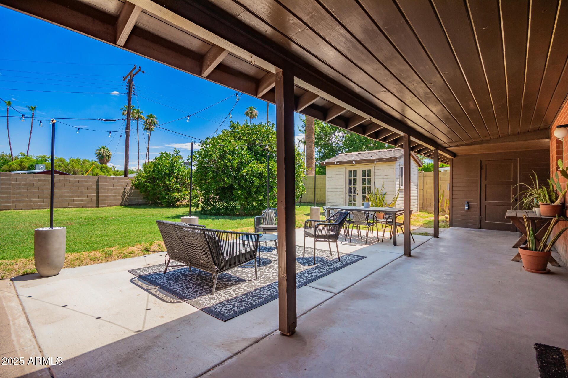 1126 East Lawrence Road Phoenix, AZ 85014 - Photo 35 of 41 a view of a patio with table and chairs and potted plants