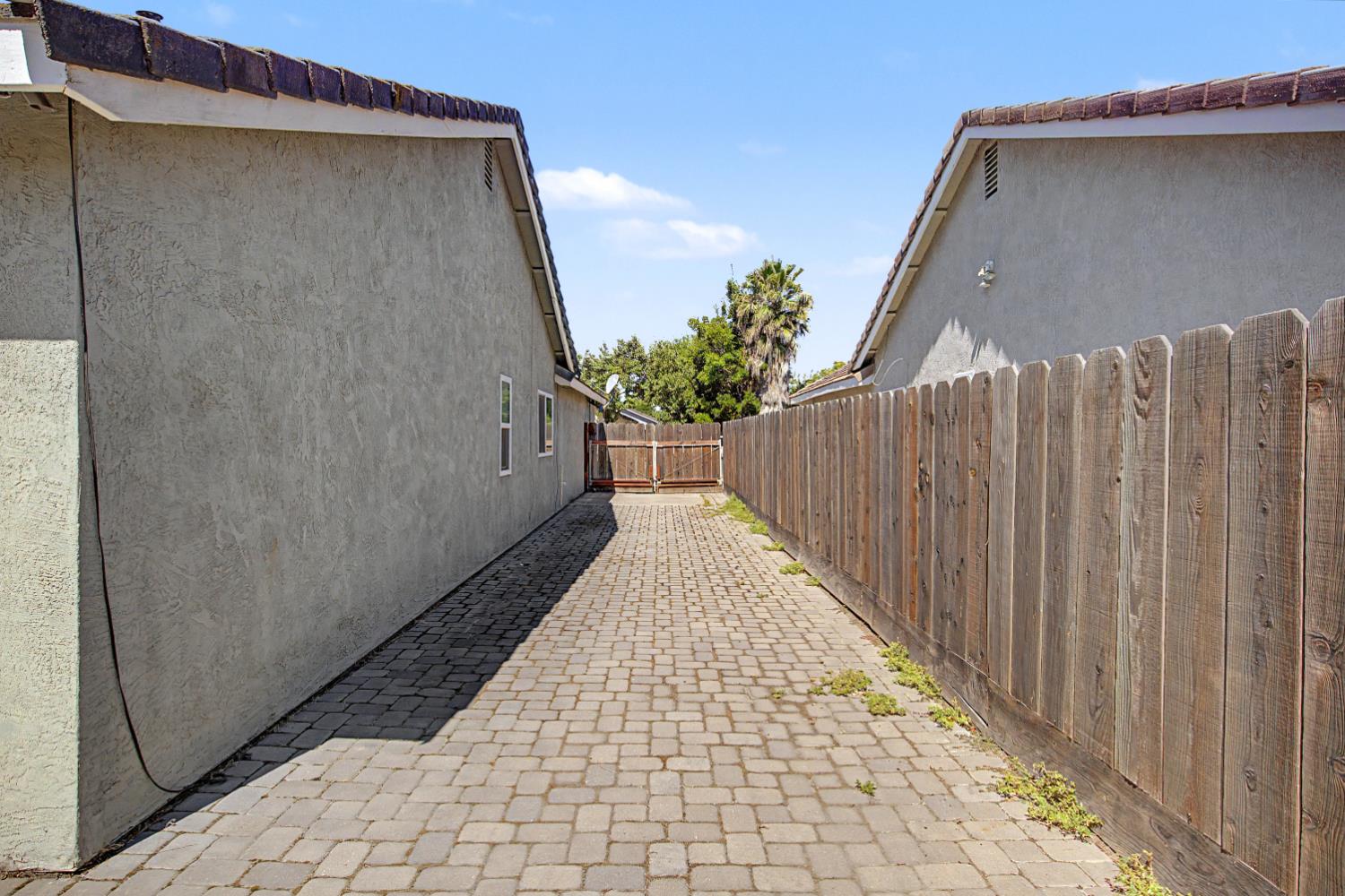 204 Gelf Lane Modesto, CA 95357 - Photo 28 of 29 RV parking on north side of the home.