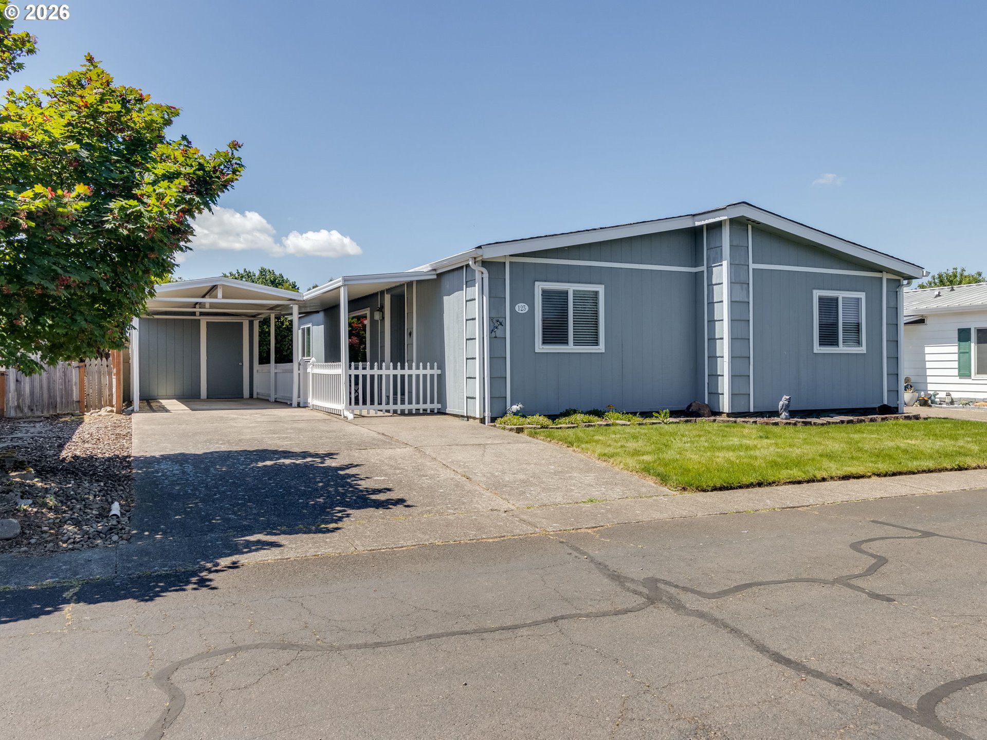 4730 Auburn Road Northeast, Unit 125 Salem, OR 97301 - Photo 23 of 36 a front view of house with yard and trees around