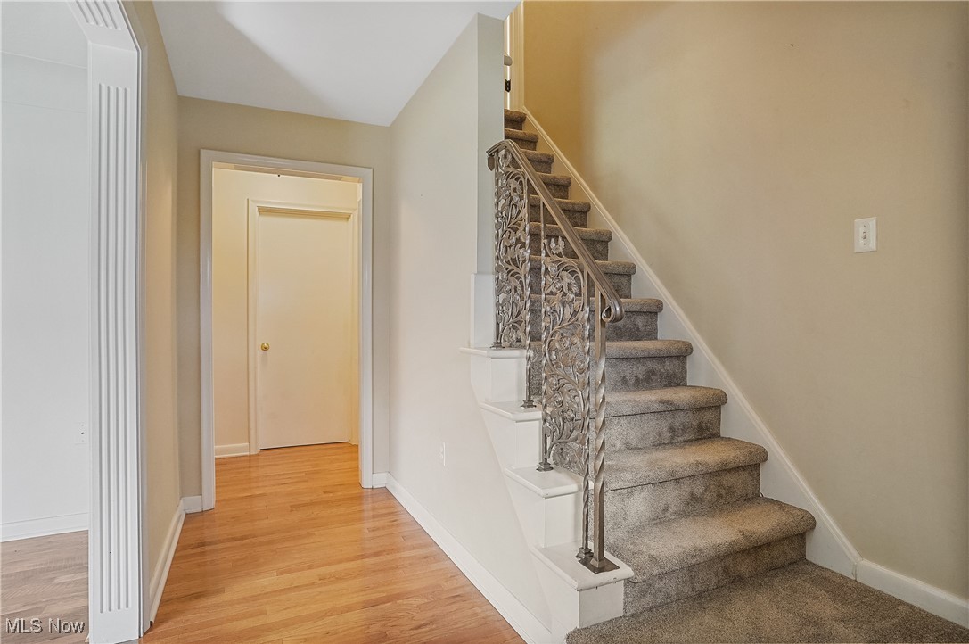 33825 Cannon Road Solon, OH 44139 - Photo 20 of 44 Stairs featuring baseboards and wood finished floors