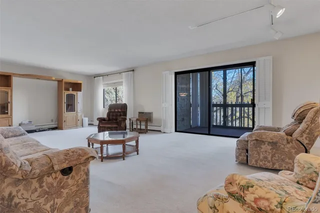a living room with furniture window and a couch