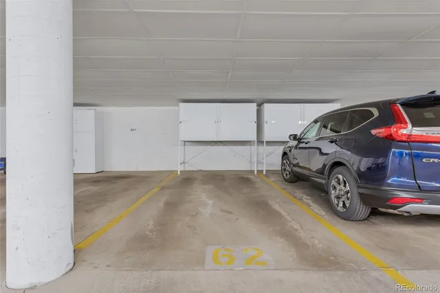 a front view of a building with trees