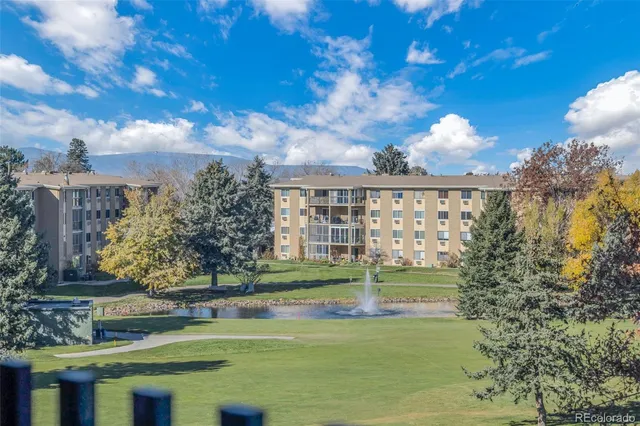 a view of a fountain in front of lake