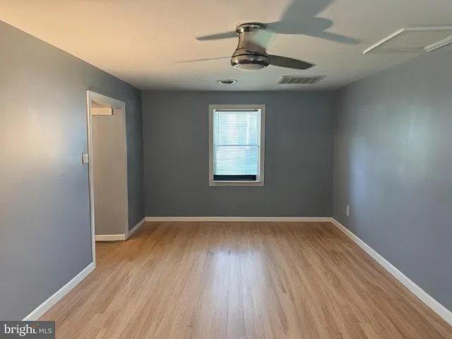 an empty room that has a window