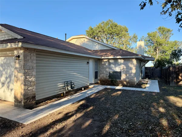 a view of a back yard of the house