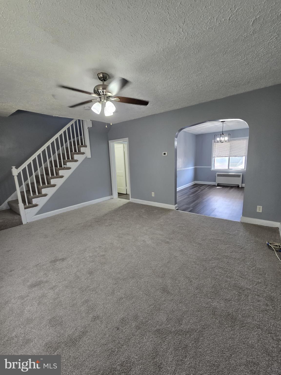 6105 Frederick Road Catonsville, MD 21228 - Photo 4 of 38 a view of a livingroom with a ceiling fan and window