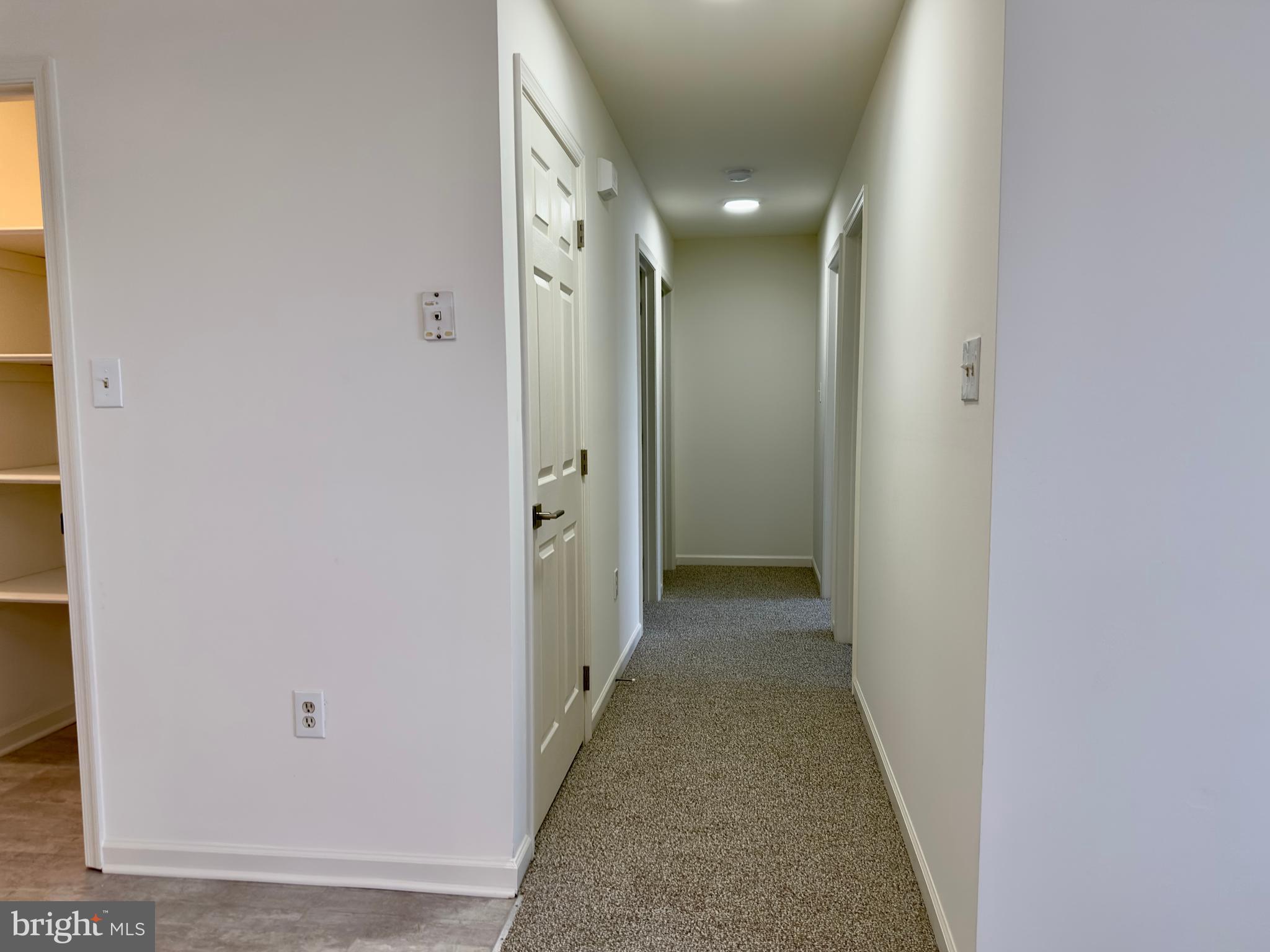 10 Sequoia Drive Berlin, NJ 08009 - Photo 16 of 22 a view of a hallway with wooden floor and closet