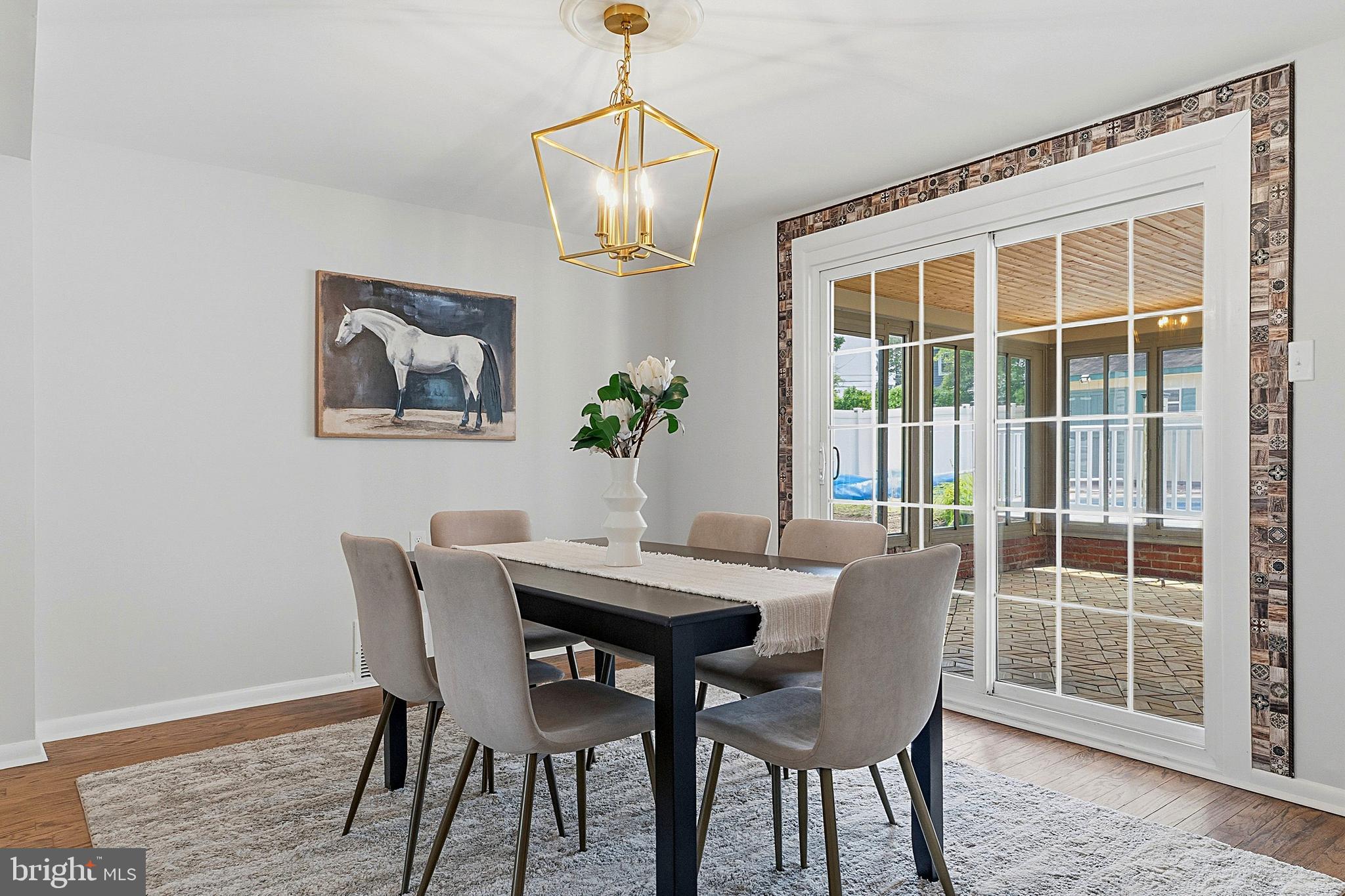 117 Harvest Road Cherry Hill, NJ 08002 - Photo 10 of 35 a dining room with furniture a window and wooden floor