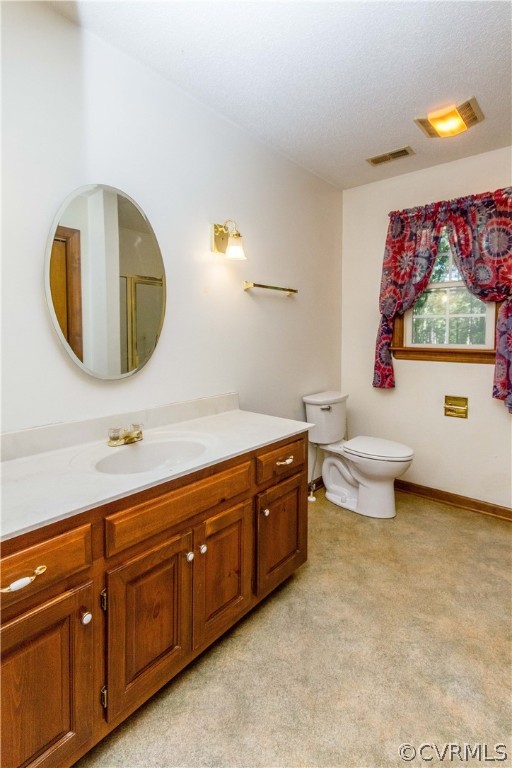 19880 Turkey Ridge Road Carson, VA 23830 - Photo 11 of 20 a bathroom with a toilet a sink and a mirror