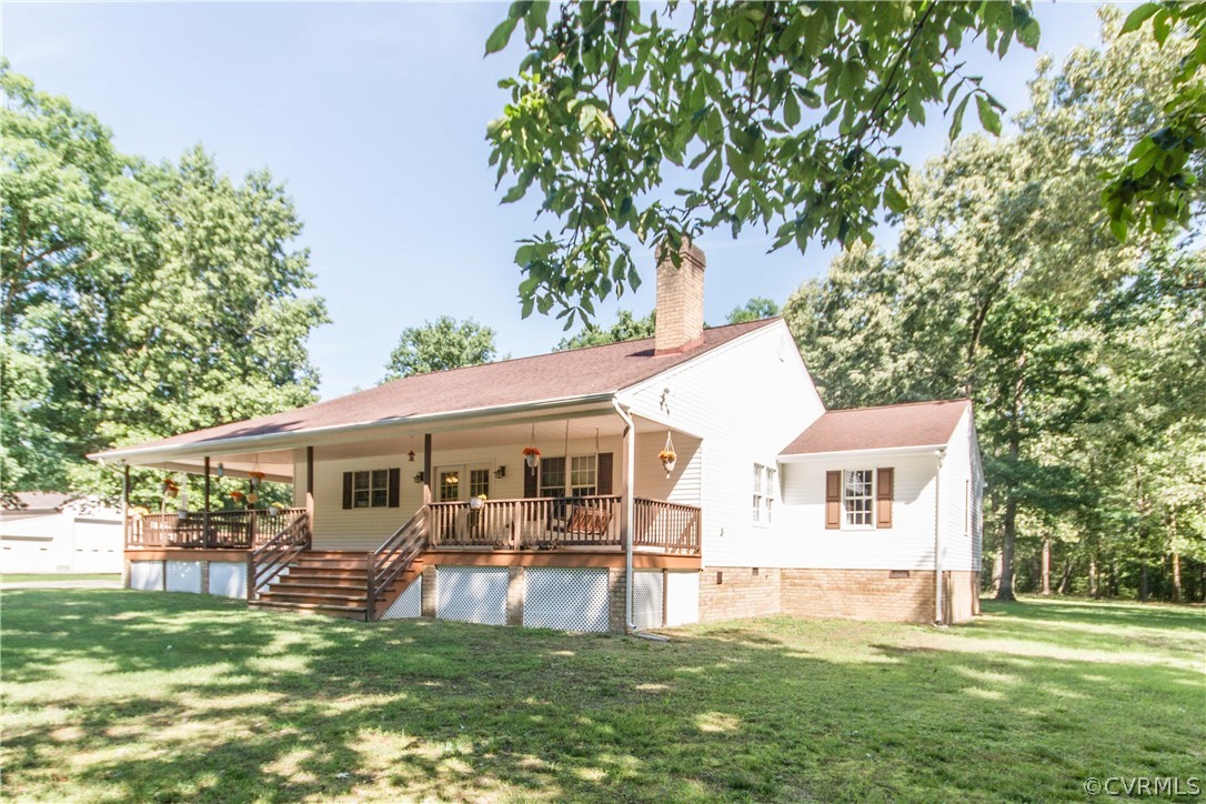 19880 Turkey Ridge Road Carson, VA 23830 - Photo 3 of 20 a view of a white house with a big yard and sitting area