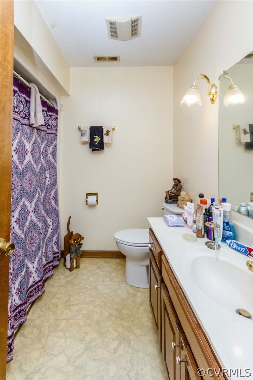 19880 Turkey Ridge Road Carson, VA 23830 - Photo 10 of 20 a bathroom with a sink toilet and mirror