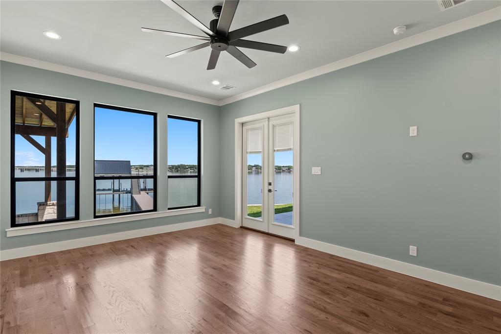 4054 Smothers Road Caney City, TX 75148 - Photo 9 of 40 Waterfront-facing bedroom retreats. Direct patio access.