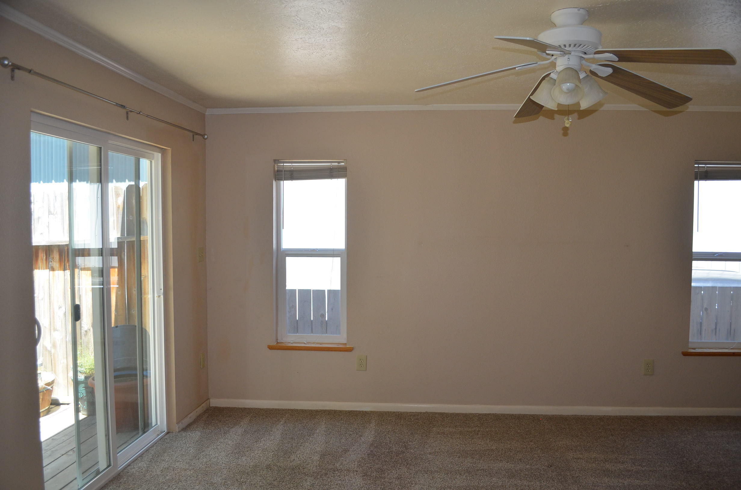 137008 Main Street Crescent, OR 97733 - Photo 29 of 50 an empty room with windows and fan