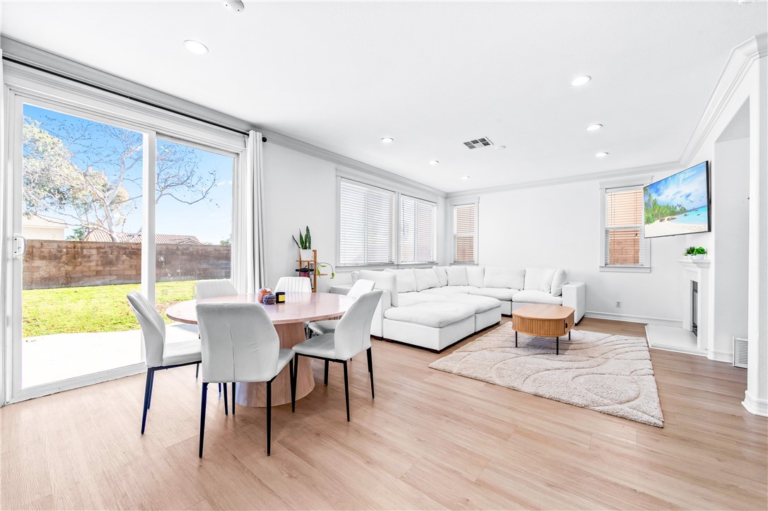 6310 Cosmos Street Eastvale, CA 92880 - Photo 14 of 71 a living room with furniture and a large window