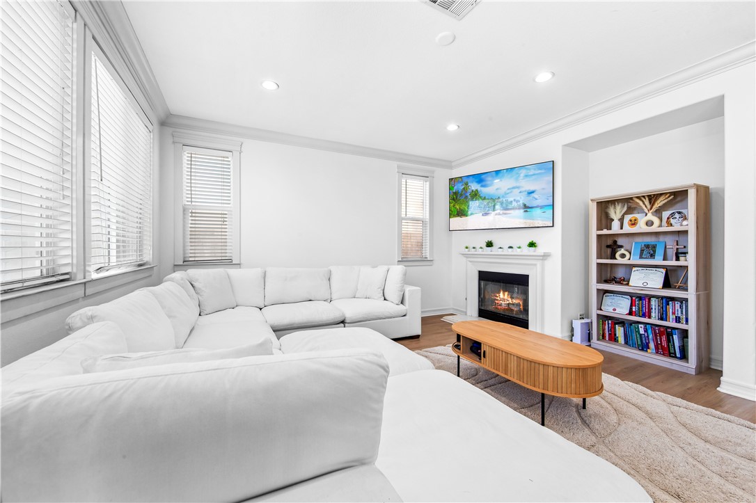 6310 Cosmos Street Eastvale, CA 92880 - Photo 20 of 71 a living room with furniture fireplace and window
