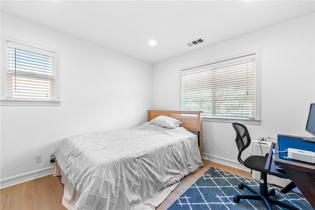 6310 Cosmos Street Eastvale, CA 92880 - Photo 40 of 71 a bedroom with a bed chair and a window