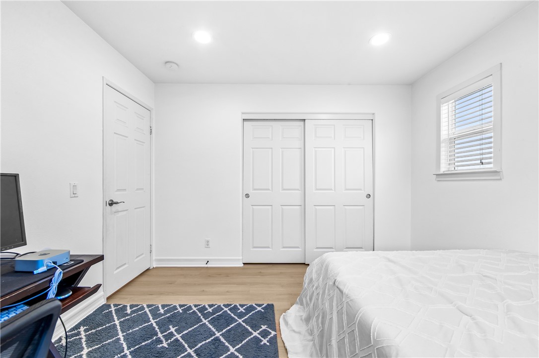 6310 Cosmos Street Eastvale, CA 92880 - Photo 43 of 71 a bedroom with a bed and a window