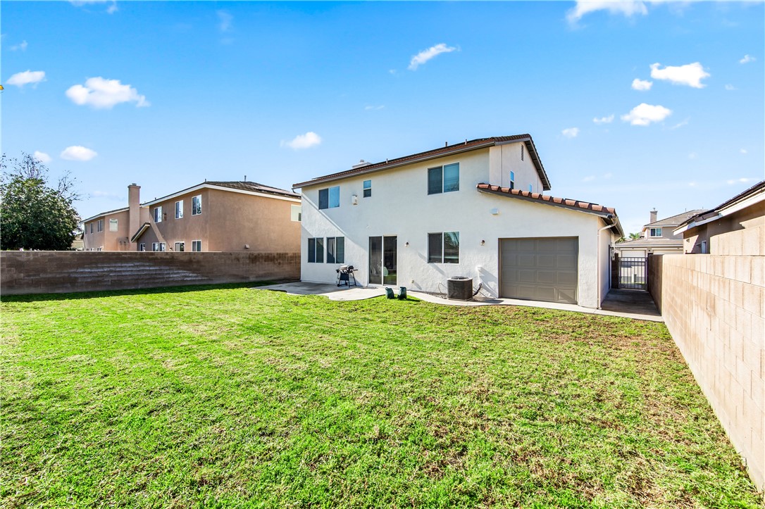 6310 Cosmos Street Eastvale, CA 92880 - Photo 62 of 71 a view of a house with a backyard