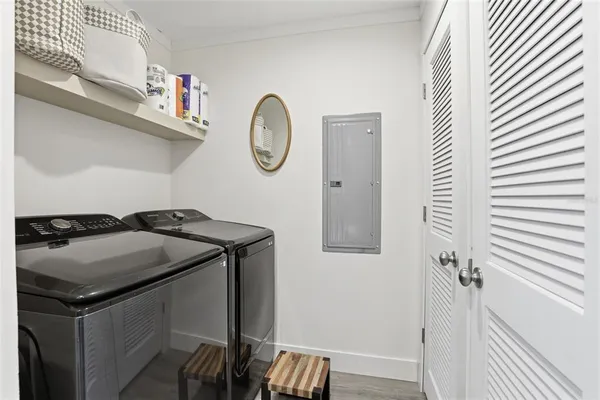 a utility room with closet and a window