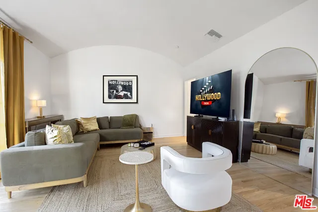 a living room with furniture and a large window