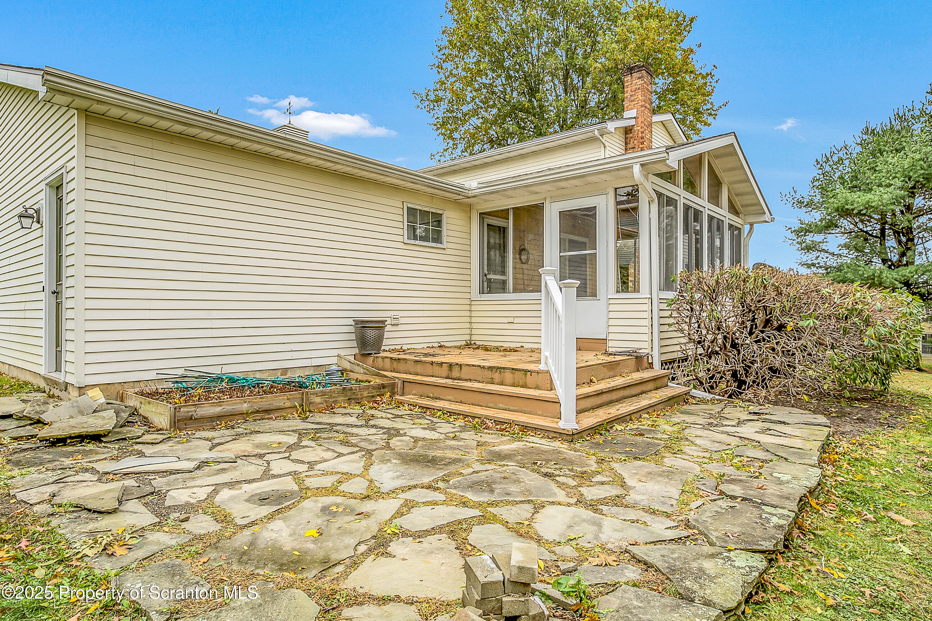 1002 Pheasant Run Road Clarks Summit, PA 18411 - Photo 11 of 53 a view of a house with a yard