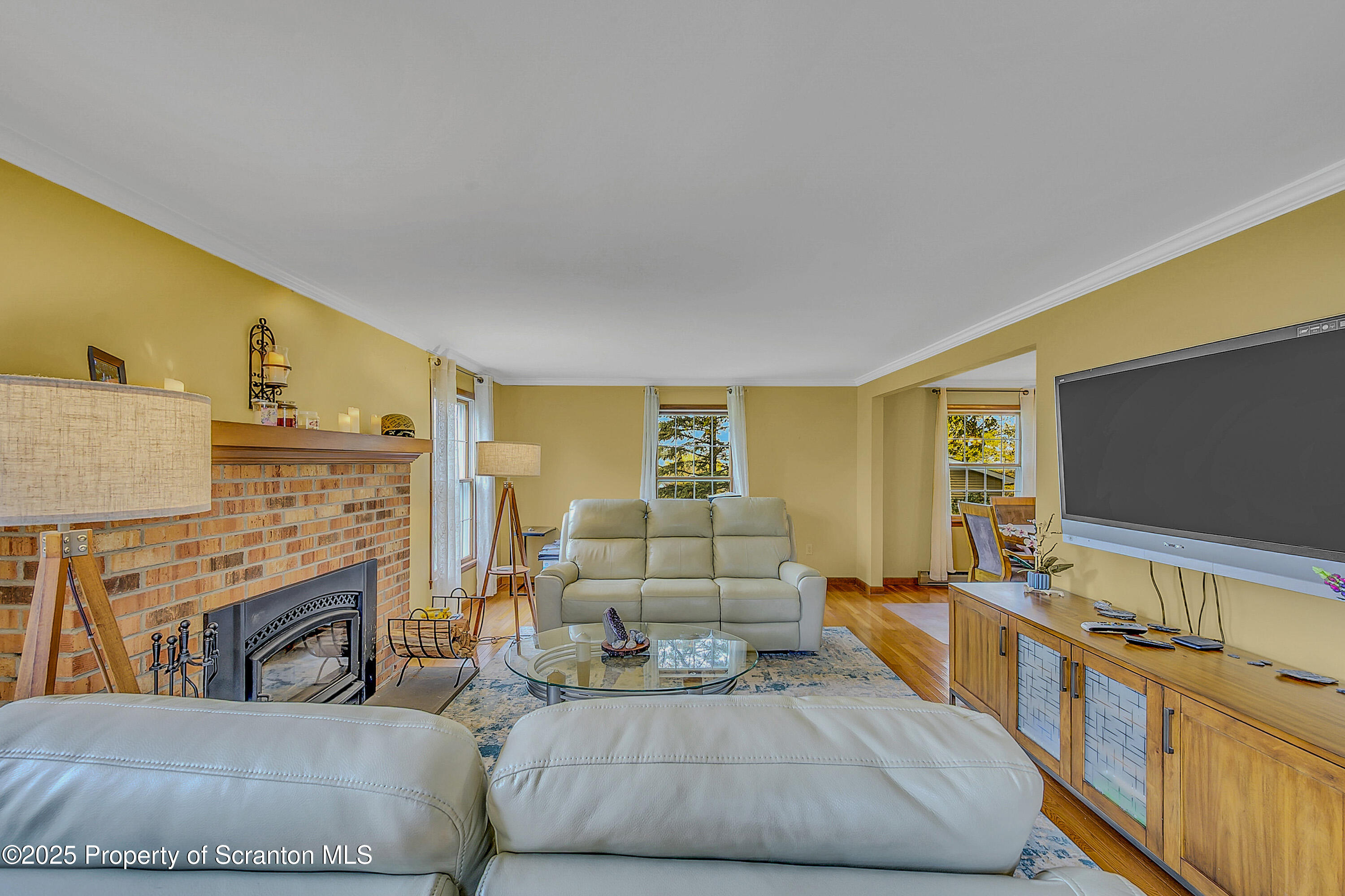 1002 Pheasant Run Road Clarks Summit, PA 18411 - Photo 13 of 53 a living room with furniture and a flat screen tv