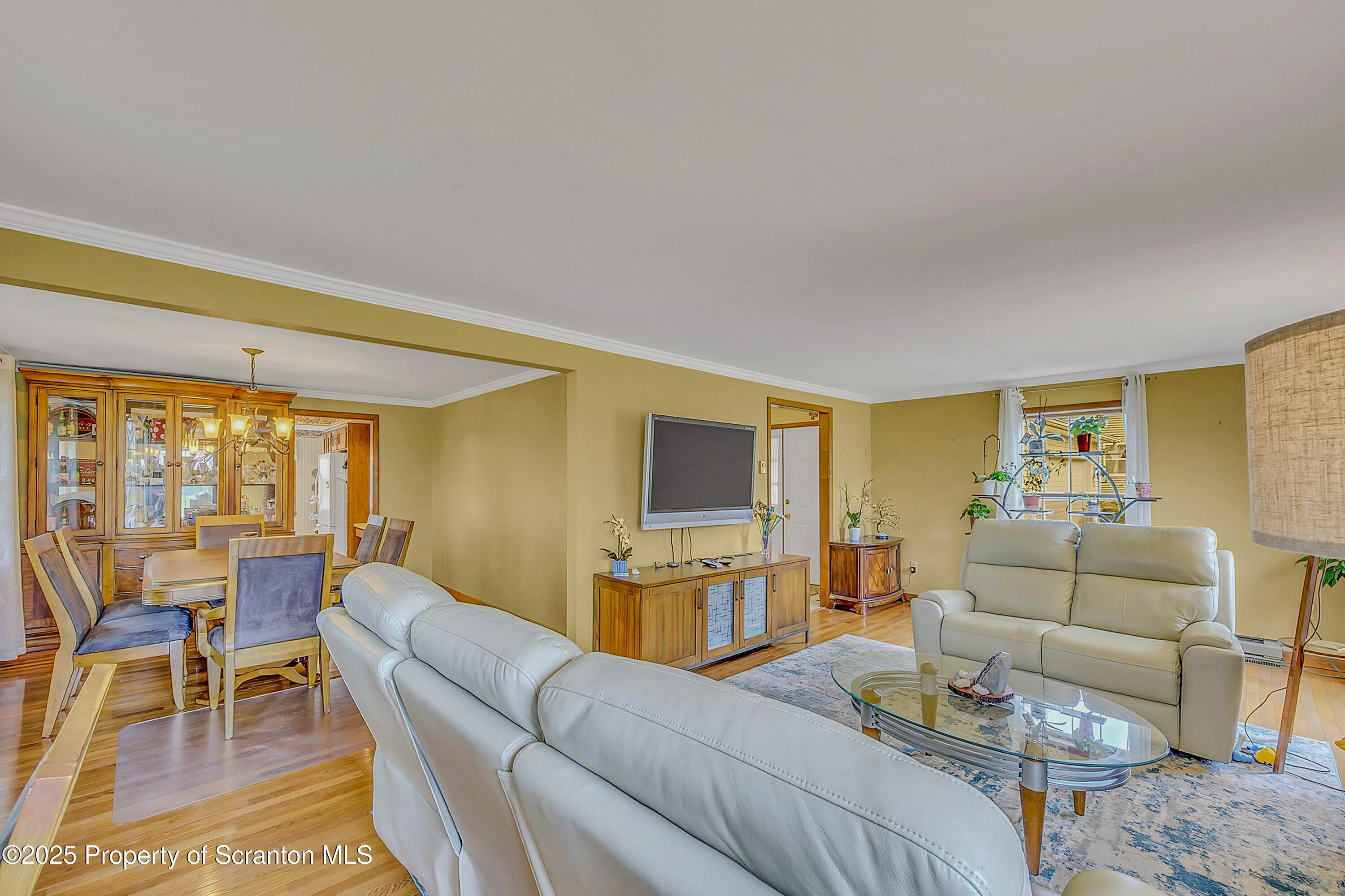 1002 Pheasant Run Road Clarks Summit, PA 18411 - Photo 15 of 53 a living room with furniture and a flat screen tv