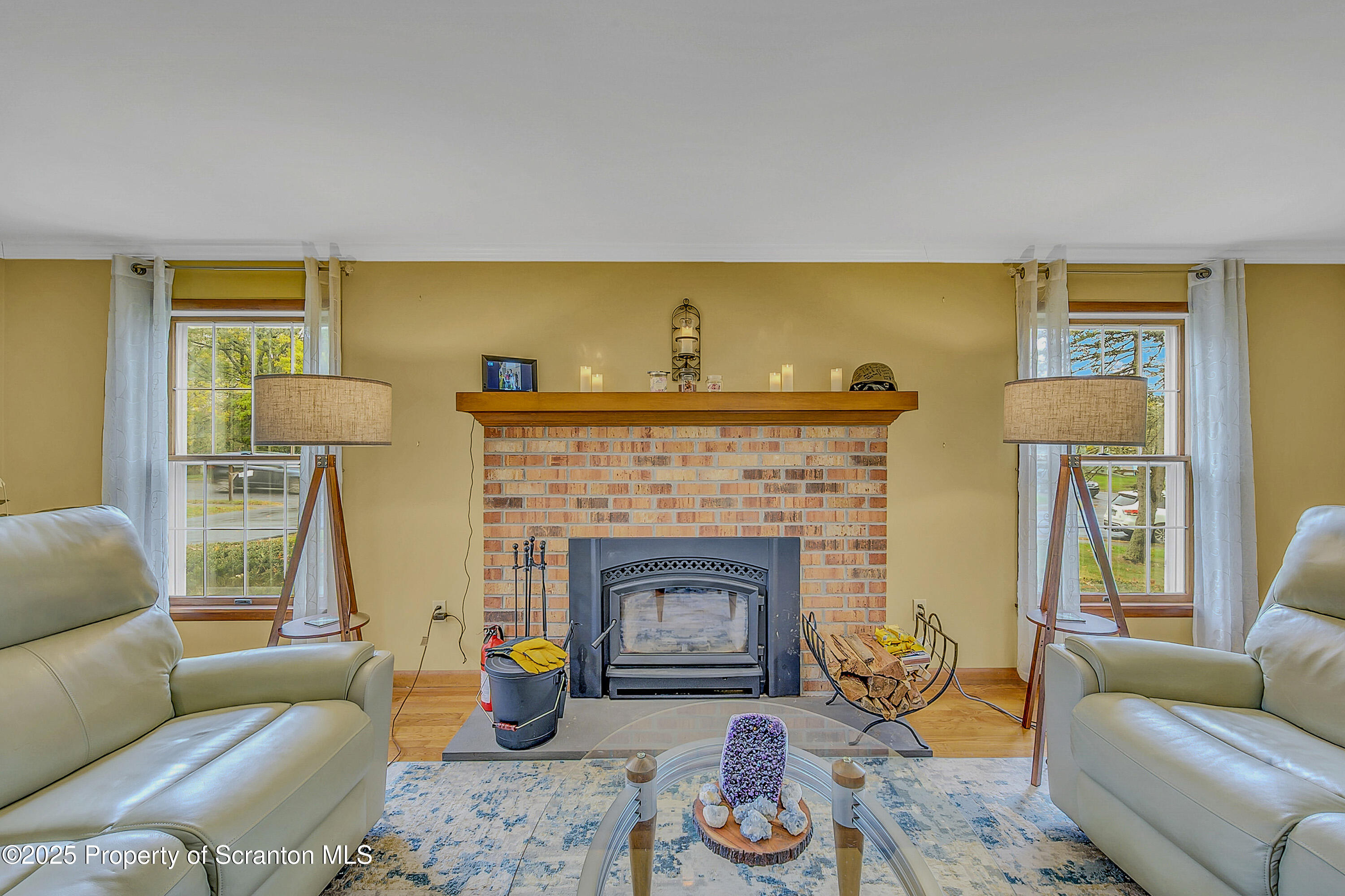 1002 Pheasant Run Road Clarks Summit, PA 18411 - Photo 2 of 53 a living room with furniture and a fireplace