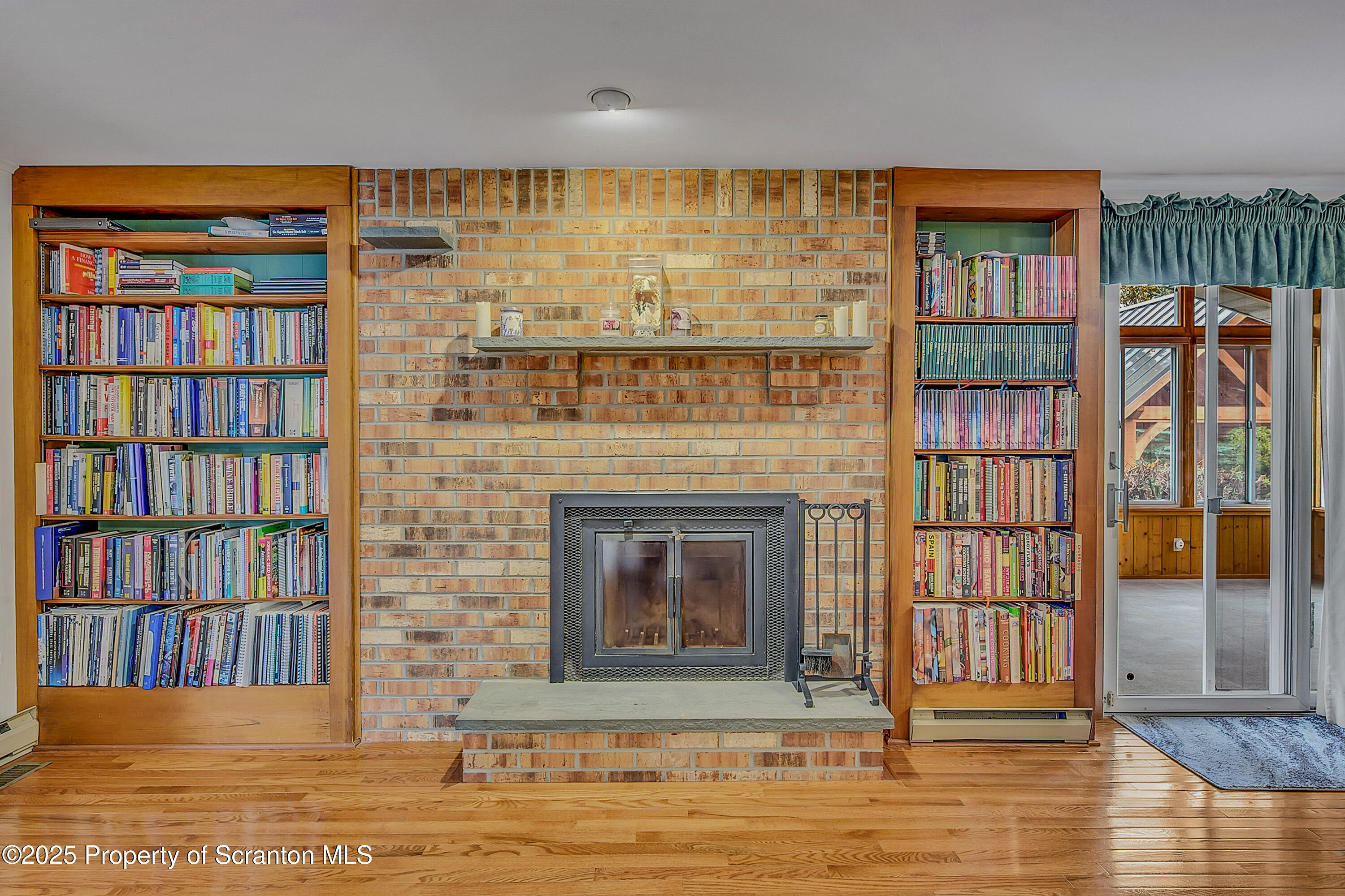 1002 Pheasant Run Road Clarks Summit, PA 18411 - Photo 3 of 53 a living room with furniture and a fireplace