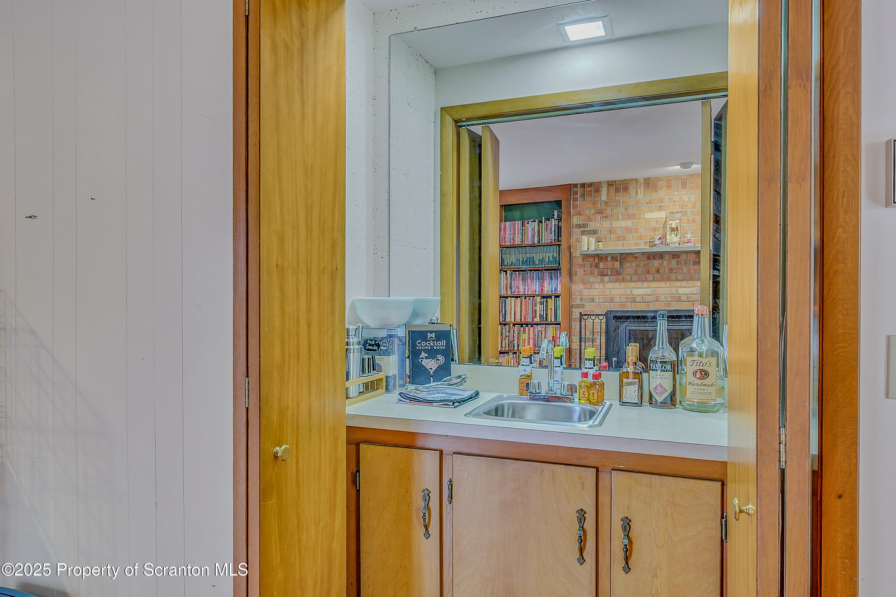 1002 Pheasant Run Road Clarks Summit, PA 18411 - Photo 31 of 53 a bathroom with a granite countertop sink and a mirror