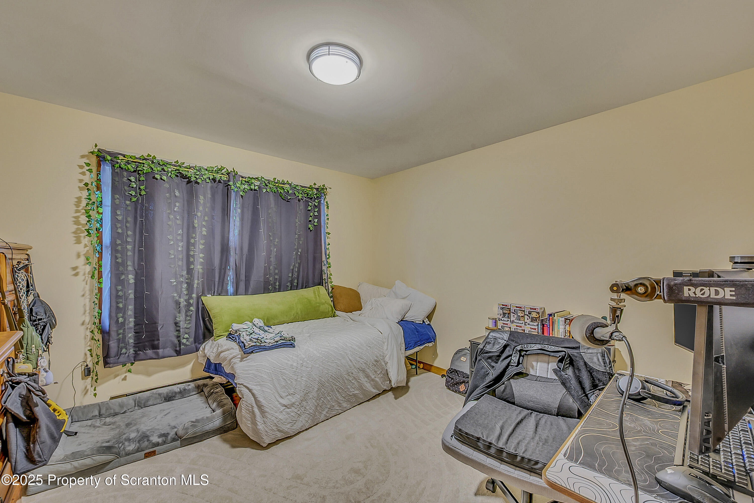 1002 Pheasant Run Road Clarks Summit, PA 18411 - Photo 35 of 53 a bedroom with furniture and a bed