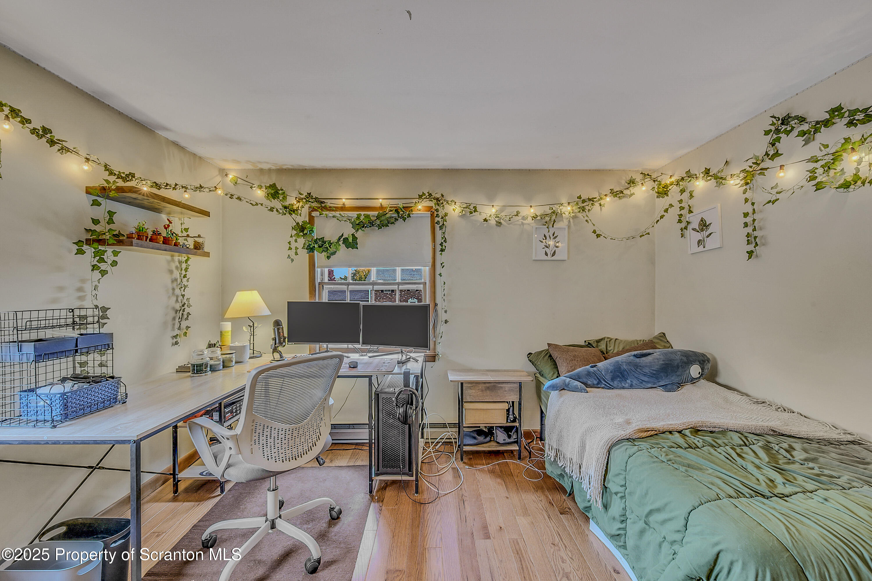 1002 Pheasant Run Road Clarks Summit, PA 18411 - Photo 41 of 53 a bedroom with a bed and a table in it