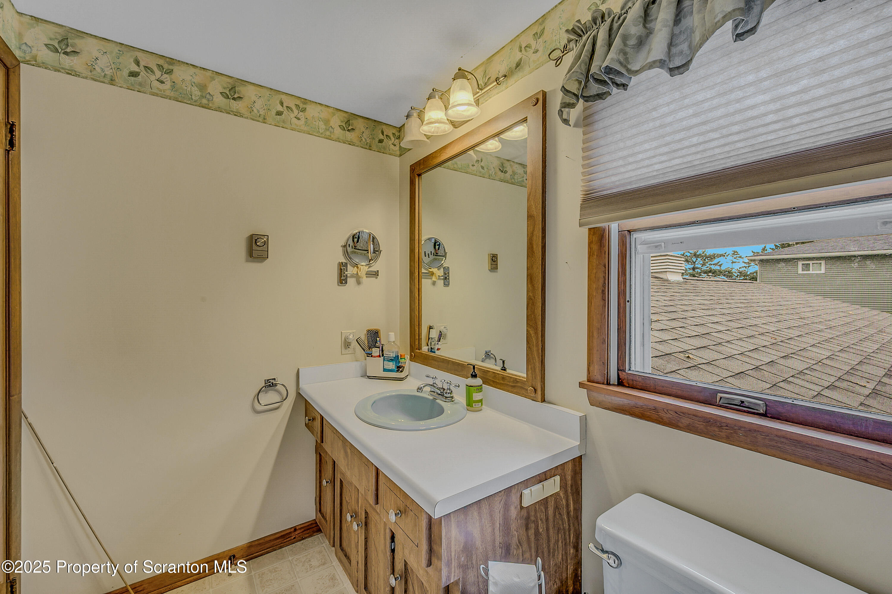 1002 Pheasant Run Road Clarks Summit, PA 18411 - Photo 45 of 53 a bathroom with a sink and a mirror