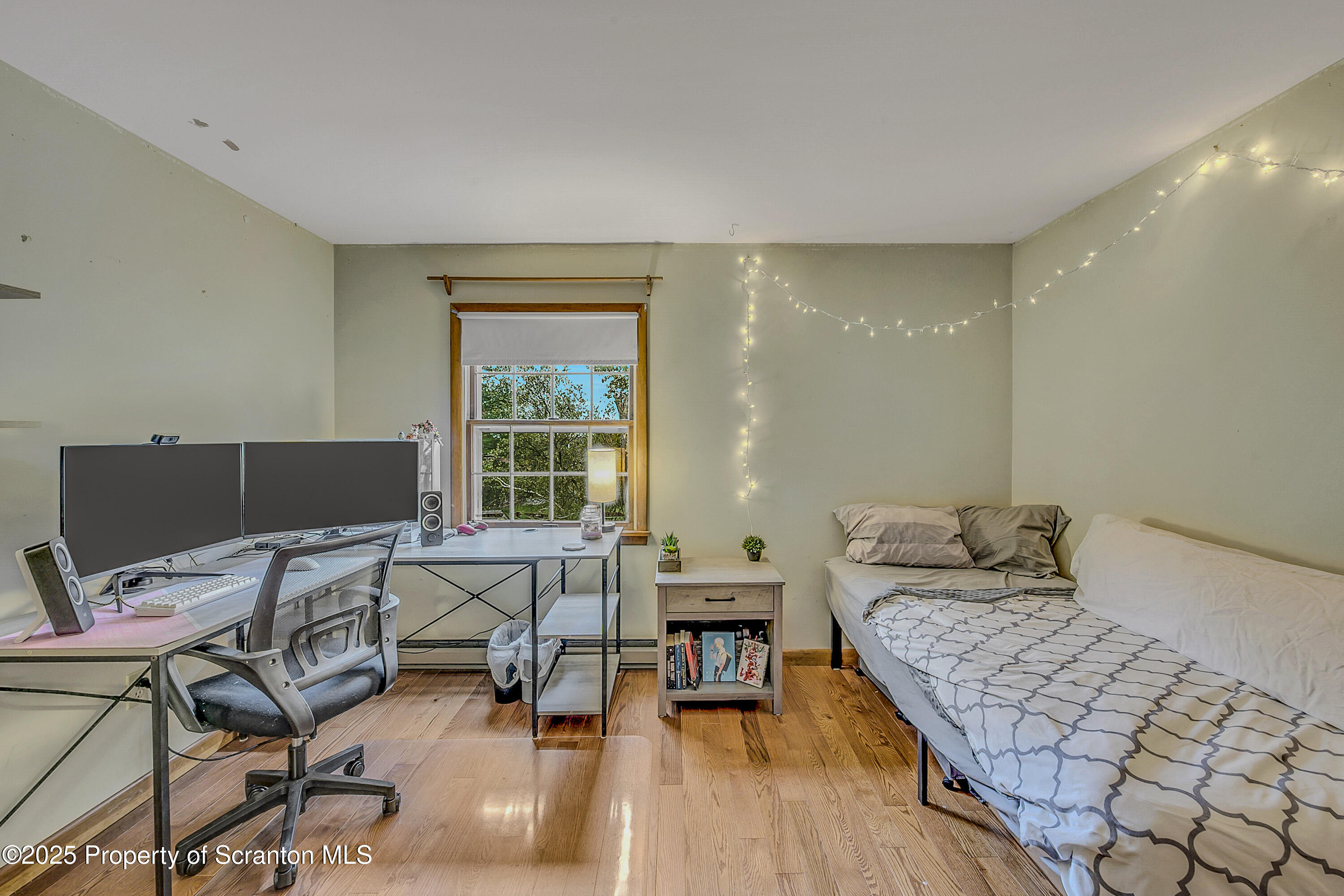 1002 Pheasant Run Road Clarks Summit, PA 18411 - Photo 46 of 53 a living room with furniture and a window