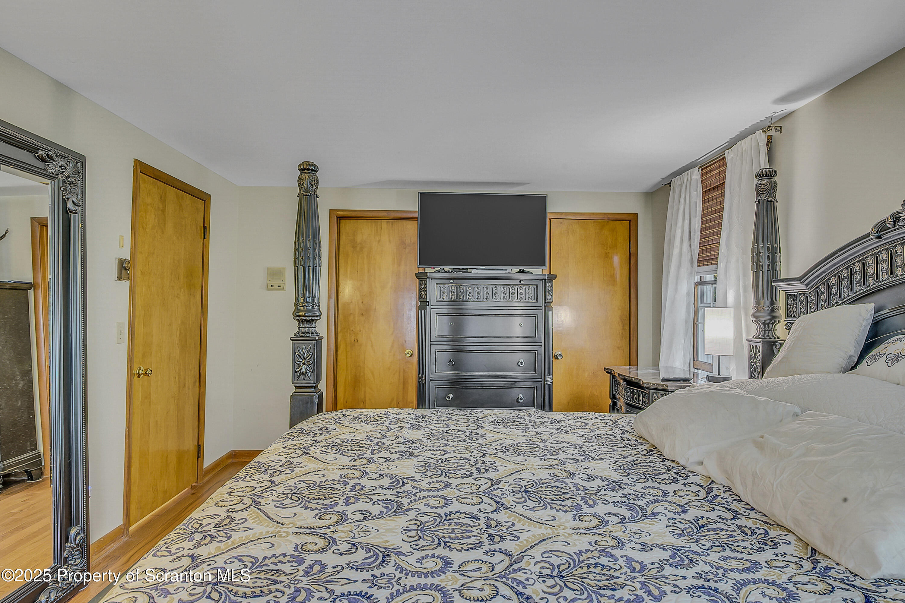 1002 Pheasant Run Road Clarks Summit, PA 18411 - Photo 48 of 53 a bedroom with a bed and a dresser