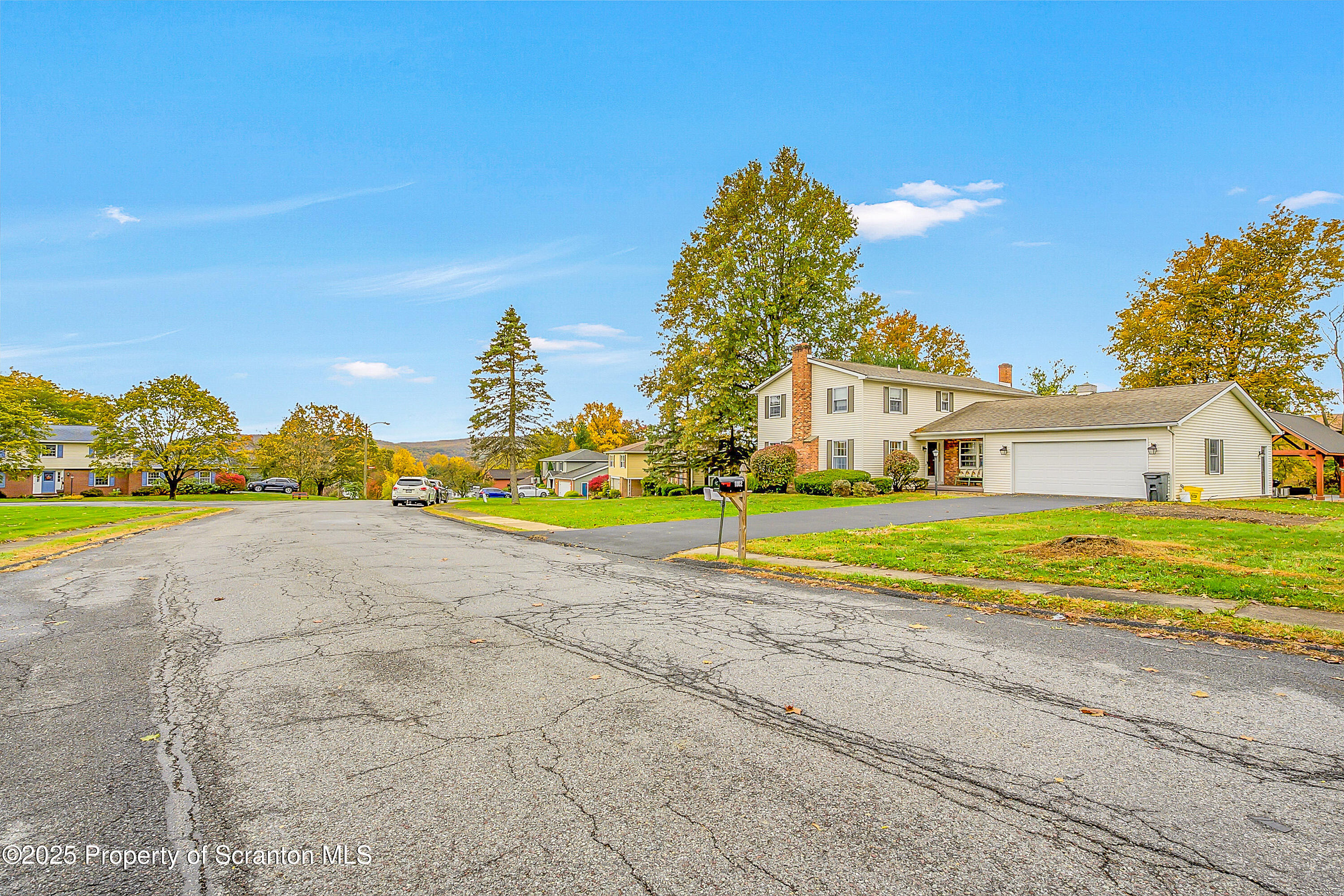 1002 Pheasant Run Road Clarks Summit, PA 18411 - Photo 6 of 53 a view of a house with a yard and a large tree