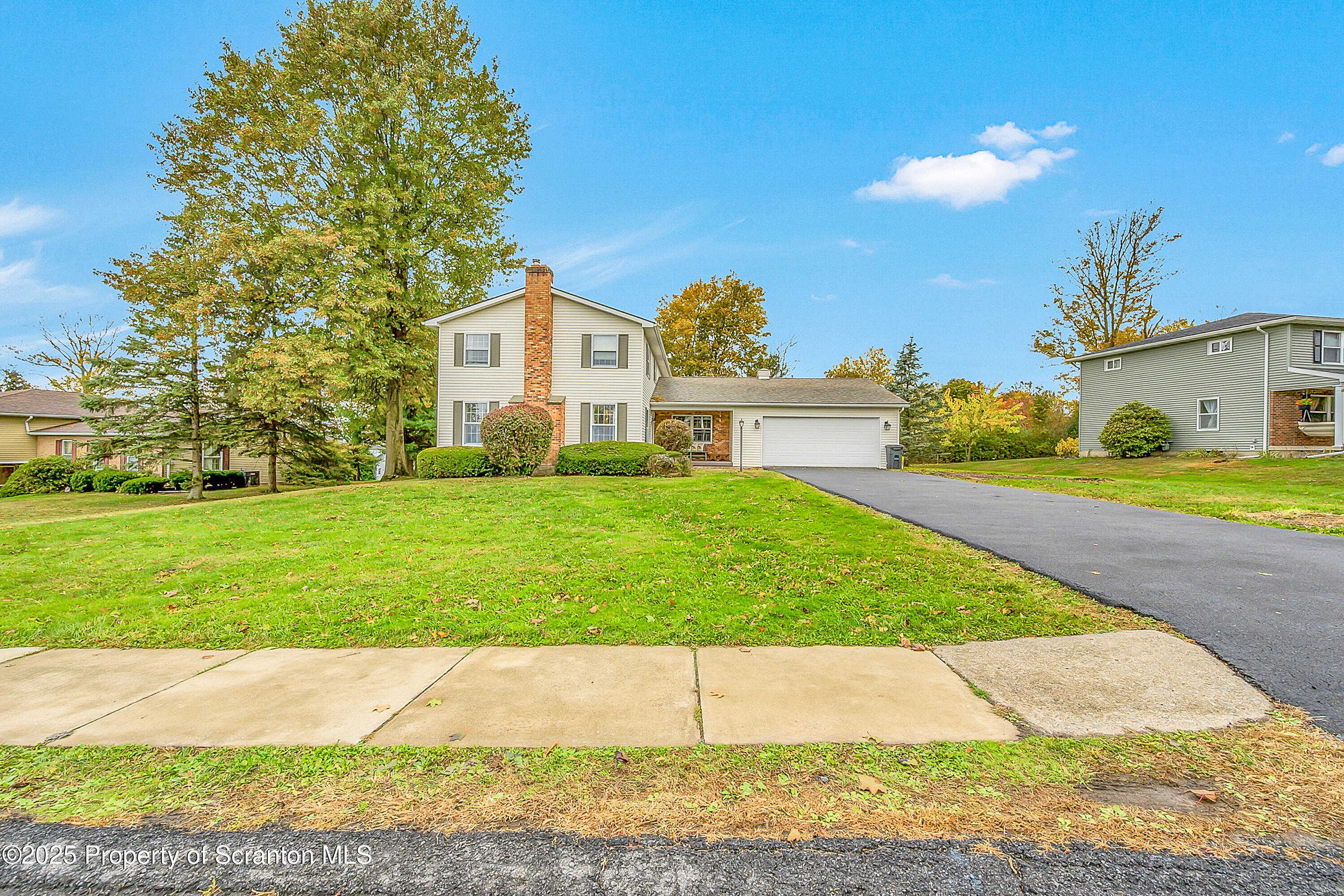 1002 Pheasant Run Road Clarks Summit, PA 18411 - Photo 7 of 53 a view of a house with a yard and street