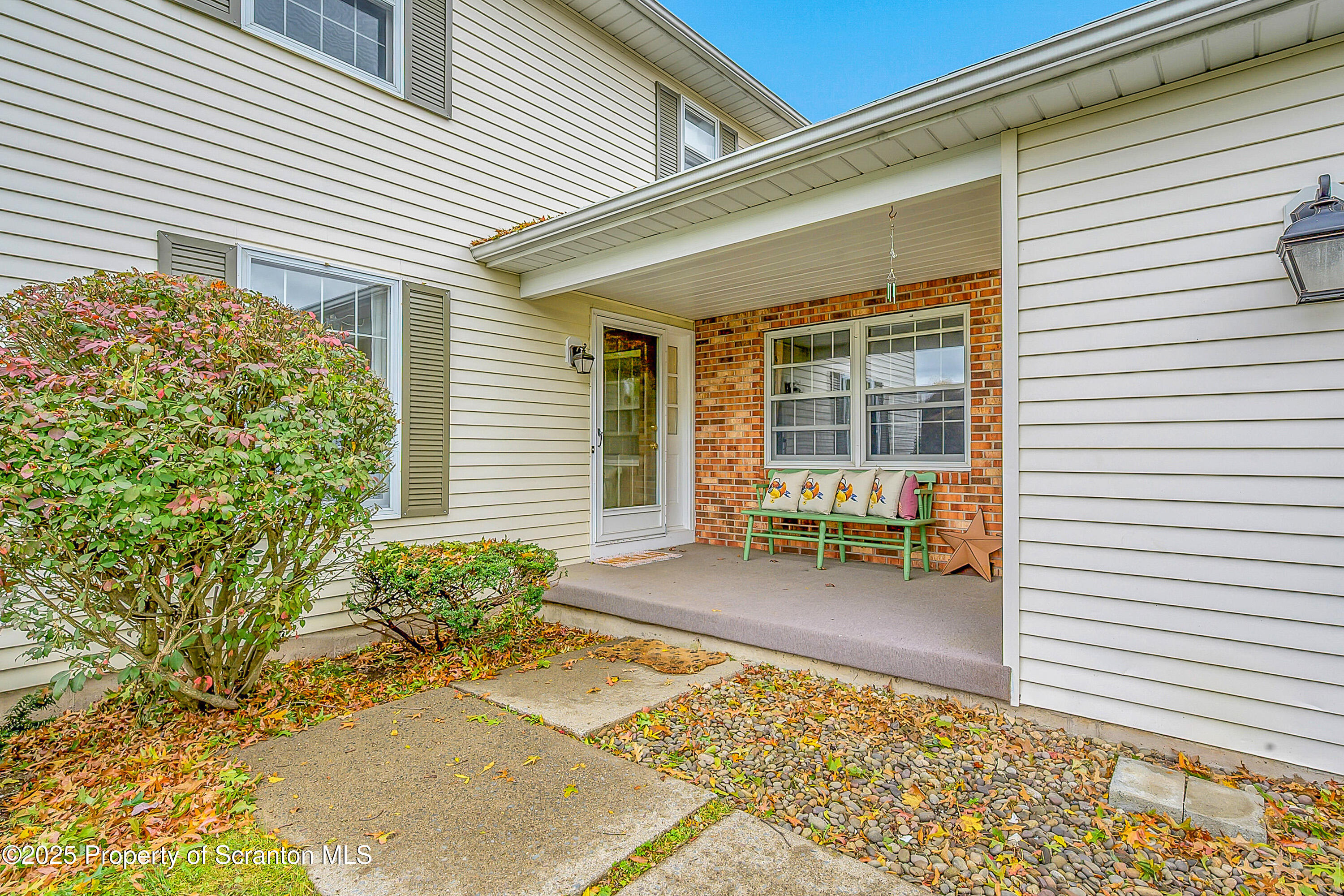 1002 Pheasant Run Road Clarks Summit, PA 18411 - Photo 8 of 53 a backyard of a house with outdoor seating