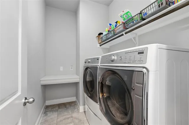 a utility room with dryer and washer