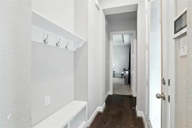 a view of a bathroom from the hallway