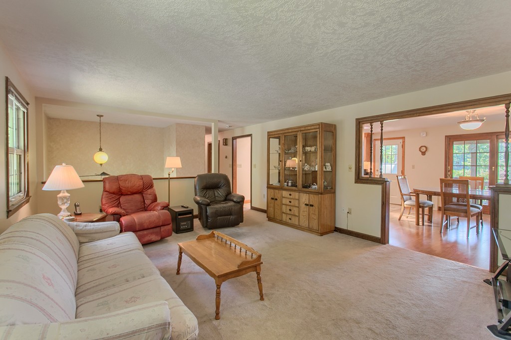 24 Newton Road Westminster, MA 01473 - Photo 14 of 30 a living room with furniture and a dining table with floor to ceiling window