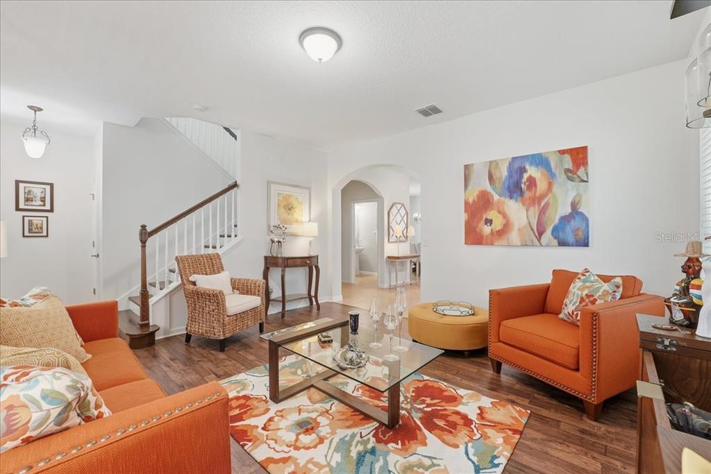 11675 Snail Kite Way Windermere, FL 34786 - Photo 11 of 46 a living room with furniture and wooden floor