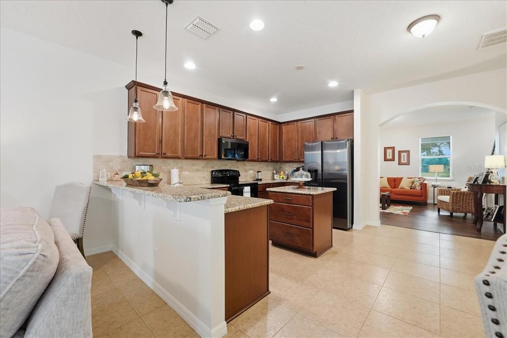11675 Snail Kite Way Windermere, FL 34786 - Photo 14 of 46 a kitchen with cabinets and window