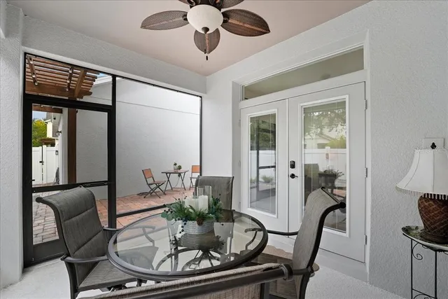 a dining room with furniture and wooden floor