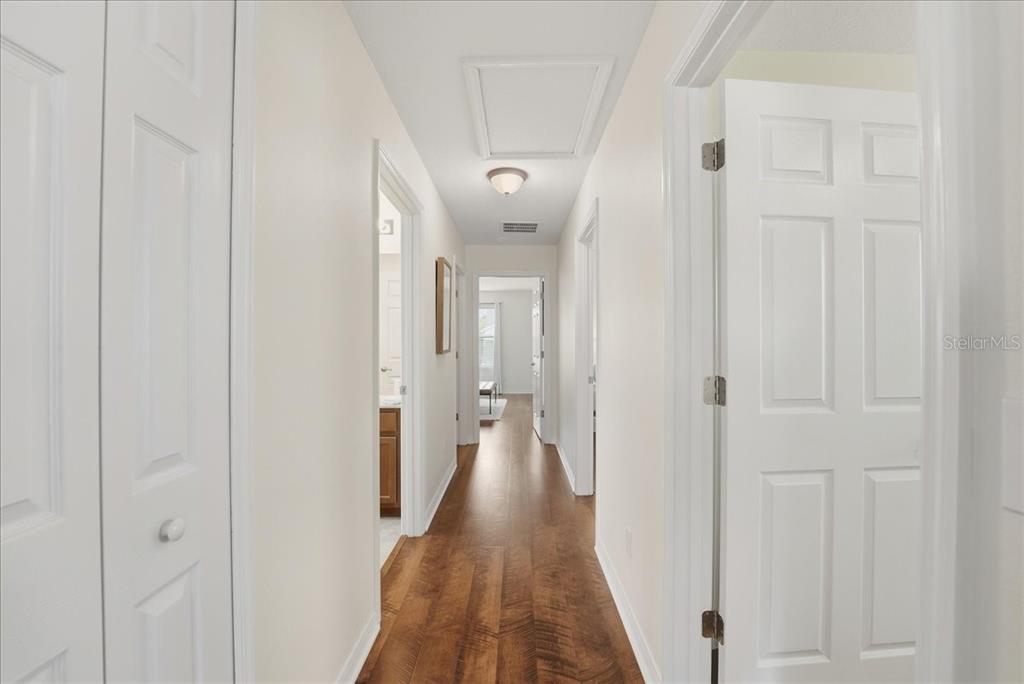 11675 Snail Kite Way Windermere, FL 34786 - Photo 29 of 46 a view of a hallway with wooden floor