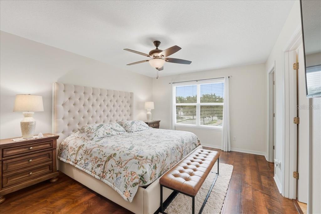 11675 Snail Kite Way Windermere, FL 34786 - Photo 30 of 46 a bedroom with a bed and a window