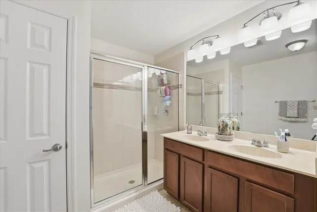 a bathroom with a sink and cabinets