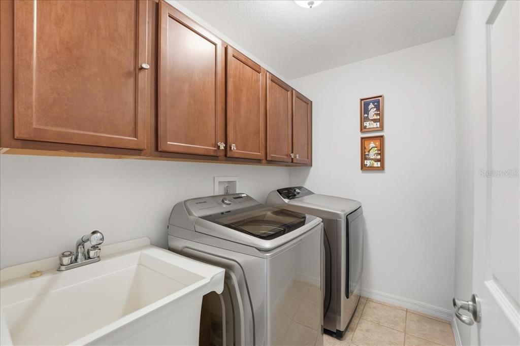 11675 Snail Kite Way Windermere, FL 34786 - Photo 34 of 46 a bathroom with a sink and cabinets