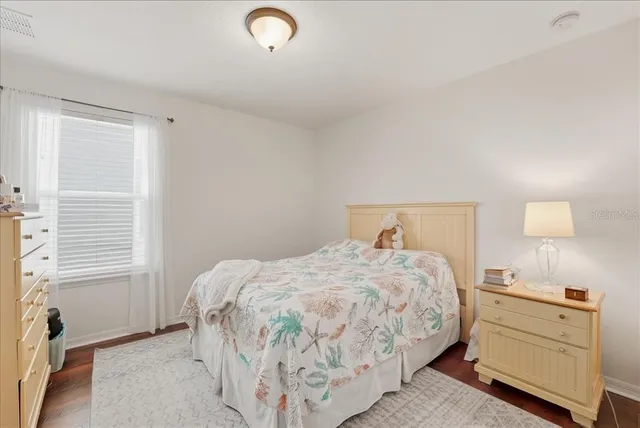 a bedroom with a bed and a cabinets